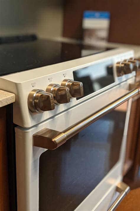 stainless appliances with gold handles